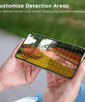 Person holding smartphone with app interface for 2K Ultra Clear Solar Wireless Outdoor Security Camera With 360 Degree PTZ, Spotlight And Siren