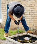 Heavy Duty 17 Inch Water Meter Key And Shut Off Tool With Four Way Utility Socket used by man on a water valve.