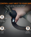 Close-up of hand using the wireless remote on the Beast Mode 2000 Lumens Bike Light for night riding and mountain biking.