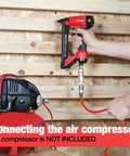 Connecting Pneumatic 20 Gauge Staple Gun For Upholstery And Carpentry to air compressor, rear exhaust visible