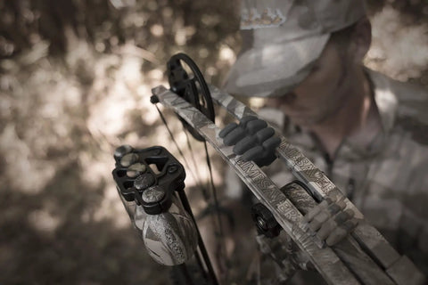 Close-up of a bow with Camouflage Bow Vibration Dampeners For Unisex Adults Cuts Noise By Up To 70 Percent With NAVCOM Material