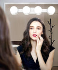 Woman using Cordless Rechargeable LED Vanity Mirror Light With 6500K Daylight Bulbs For Bathroom Makeup And Dressing Tables