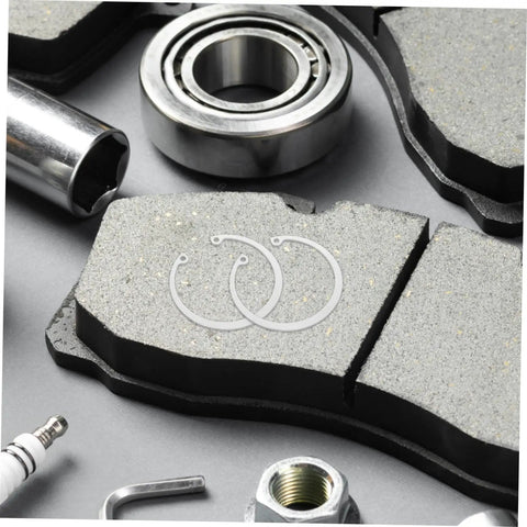 5 Piece Stainless Steel C Clip Retaining Ring Kit With Internal And External Circlips Snap Rings For Secure Attachment And Easy Installation No Fuss For DIY Projects Machinery And Auto Repairs, displayed on brake pads with automotive tools.