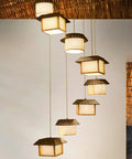 Massive Staircase Chandelier With Eight Bamboo Shades And Long Adjustable Drop serving serious retro country vibes to your entryway.
