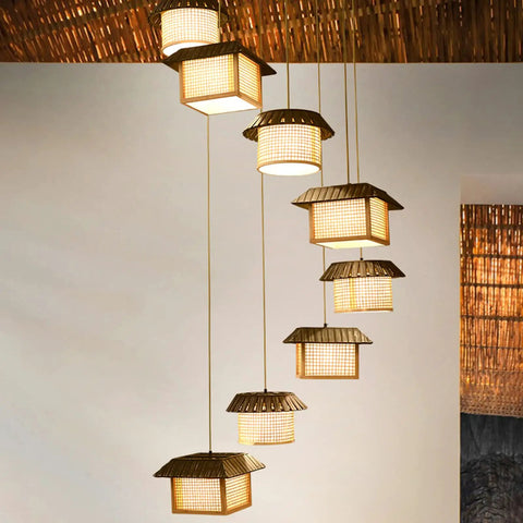 Massive Staircase Chandelier With Eight Bamboo Shades And Long Adjustable Drop serving serious retro country vibes to your entryway.