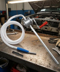 Super Handy Gralaria Manual Oil Transfer Pump For Mechanics And Garage Pros With 2M Hose Plus 32Cm Inlet Pipe on a workshop table.