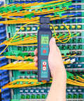 Person using All-In-One Fiber Identifier And VFL Tester For FTTH, 800 To 1700nm, LED backlit display, fiber network test