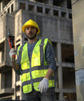 High Visibility Safety Vest With Reflective Strips And Zipper, Yellow XL worn by construction worker holding drill on site