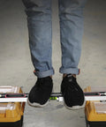 Person standing on Pro Grade Aluminum Measuring Tool With Bubble Level Ruler For Mud Work Heavy Duty Anti Drop Design