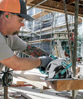 Professional 8 1 4 Inch Magnesium Circular Saw With Electric Brake and Dual LED Cut Line Lights in use on lumber.
