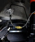 Close-up of 5/16 Inch Brake Line Tubing Kit, 25 Ft PVF Coated Steel Tube Roll installed in vehicle system