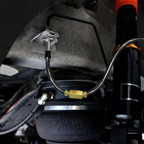 Close-up of 5/16 Inch Brake Line Tubing Kit, 25 Ft PVF Coated Steel Tube Roll installed in vehicle system