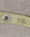 Close-up of M1 Carbine Web Sling OD Green One Inch Canvas Reproduction With Lift-The-Dot Closure WWII Style Steel Fixtures