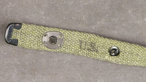 Close-up of M1 Carbine Web Sling OD Green One Inch Canvas Reproduction With Lift-The-Dot Closure WWII Style Steel Fixtures