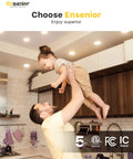 Father lifting child in family kitchen with warm lighting from 36 Pack 6 Inch Led Recessed Lights Canless Wafer Downlight.