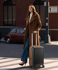 Woman with Your Go To 20 Inch Carry On Luggage Airline Approved Hard Shell Polycarbonate Case in urban setting