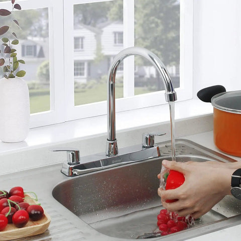 Heavy Duty Two Handle Kitchen Sink Faucet Slick Chrome Finish 360 Swivel High Arch Design Three Hole Deck Mount Tap in action rinsing vegetables.