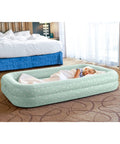 Child sleeping on Kids Travel Air Mattress With Raised Sides And Hand Pump Portable Blow Up Bed For Sleepovers Naps And Travel Plush Surface Double Support Star Print Perfect For Ages 3 To 6