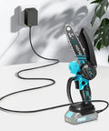 21V 1A Mini Chainsaw Battery Charger For Li Ion Power Tools connected to cordless chainsaw, on table with plug visible