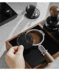 Premium Double Layer Reusable Espresso Shower Screen Filter For 51mm Portafilter shown in use over a portafilter with coffee grounds.