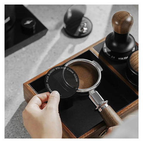 Premium Double Layer Reusable Espresso Shower Screen Filter For 51mm Portafilter shown in use over a portafilter with coffee grounds.