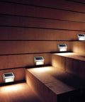 Outdoor Solar Deck Lights Pack Of 6, waterproof stainless steel LED lights illuminating outdoor stairs at night