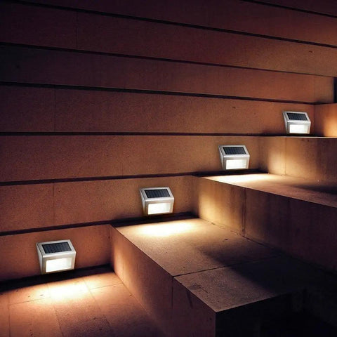 Outdoor Solar Deck Lights Pack Of 6, waterproof stainless steel LED lights illuminating outdoor stairs at night