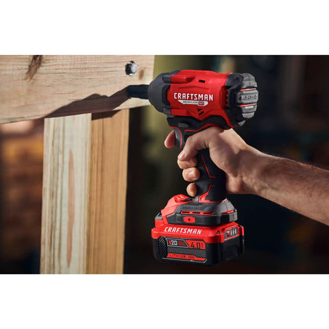 User holding V20 Cordless Impact Wrench One Half Inch Bare Tool with Brushless Motor in action, showing LED work light in use.