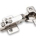 Concealed European cabinet hinge, silver metal, close-up view with mounting plate
