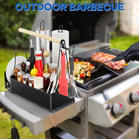 Grill Caddy With Dual Paper Towel Holders For Outdoor BBQs next to a grilling station with cooking utensils and condiments.