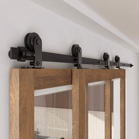 Heavy Duty 4Ft Bypass Sliding Barn Door Hardware Kit Built Tough For Two Doors Single Track System With Smooth Quiet Glide Top Mount Hangers Rust Resistant Black Steel Rail Ideal For Farmhouse Or Modern Living Spaces Door Not Included installed view