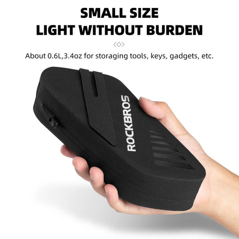 Hand holding Waterproof 0.6L Bike Saddle Bag And Frame Bag For Mountain, Road, And Folding Bikes, Lightweight Top Tube Bag