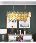 Flex Your Dining Room Vibe with K9 Crystal Oval Chandelier Pendant Light in gold finish, illuminating a modern dining space.