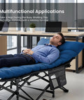 Man relaxing on blue Folding Camping Cot With 3.5-Inch Cushion, Built Tough Rollaway Bed For Indoor And Outdoor Use
