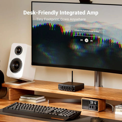 Desktop setup with BT30D Bluetooth 5.0 2.1 Channel Stereo Receiver Amplifier next to speaker and computer monitor.