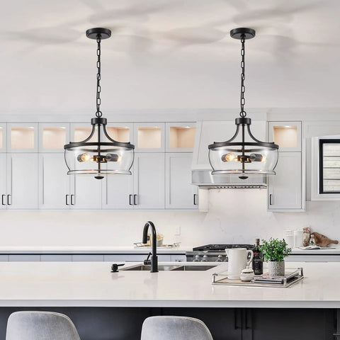 Firedanz 3-Light Glass Pendant Light, Height Adjustable hanging above a modern kitchen island with clear glass shades.