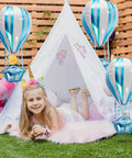 Girl posing with 4D Hot Air Balloon Mylar Foil Balloons 35 Inch Blue 4 Pack Helium Floating Decorations For Kids Birthday Party.