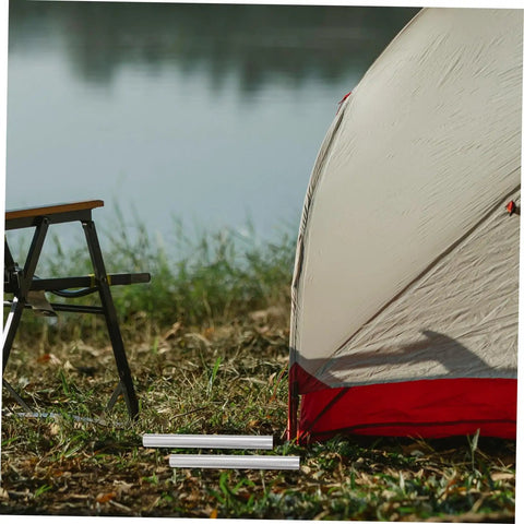 4 Pack Aluminum Alloy Tent Pole Repair Tubes Lightweight Connectors For Quick Fixes And Replacements Of Damaged Tent Poles Essential Camping Accessory next to tent on campsite