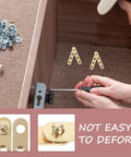 Person installing two pairs copper invisible door pivot hinges for cabinets and windows, shown with additional hardware.
