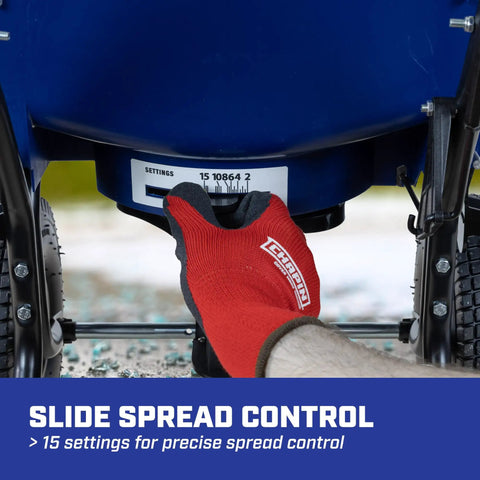 Hand adjusting settings on 80 Lb Salt Spreader For Ice Melt And Winter Weather, Walk Behind Residential Broadcast Spreader With Spiked Auger.