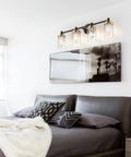 Black And Brass Vanity Light Fixture With Cylindrical Clear Stripes Glass Shade And Four Light E26 Socket Base Over Mirror Dope Vintage Modern Bathroom Lighting For Bright Stylish Vanity above bed in modern bedroom