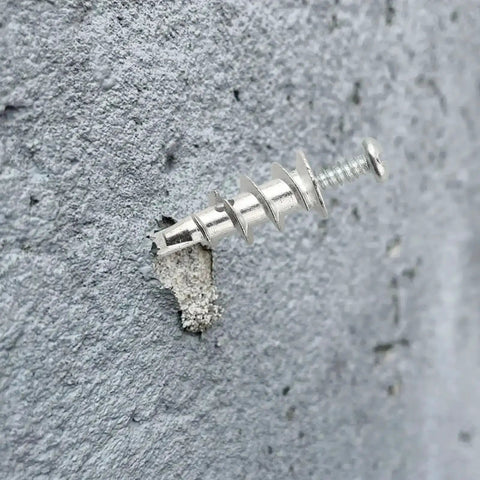 Zinc hollow wall anchor from Tool Free Self Drilling Drywall Anchors Kit 100 Pcs mounted on drywall.