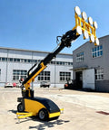 Professional Electric Glass Vacuum Lifter Heavy Duty Suction Cup Hoist with adjustable grips on a construction site.