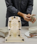 Person using Roman Column Ball Mold for Concrete DIY Projects with 3D lion model, ABS material, 12.20x8.66x8.66 inch size.