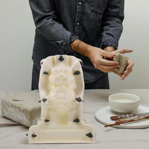 Person using Roman Column Ball Mold for Concrete DIY Projects with 3D lion model, ABS material, 12.20x8.66x8.66 inch size.