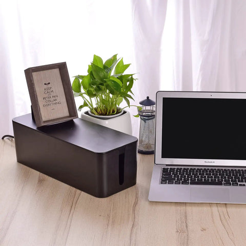 Triple Cable Organizer Box Set for Desk Tidy Up Wires Like a Pro With Large, Medium, and Small Cord Management Boxes, Power Cover Cord Holder and Surge Protector Black. Shown: Large box on desk with laptop.