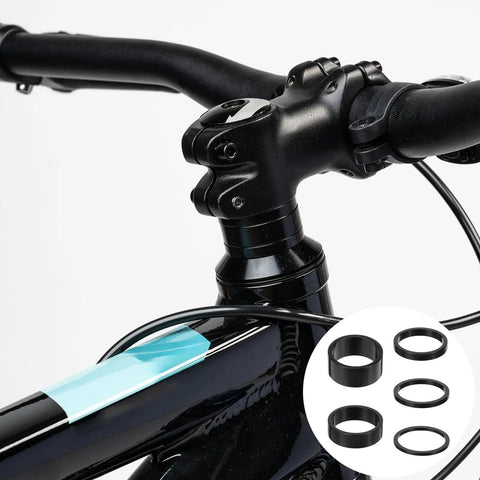 Bicycle handlebar with 9Pcs Bike Stem Spacers Set Aluminum Alloy Headset Spacers For 1 1/8 Inch Stems mounted.
