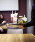 Waiter holding a tray with drinks in Stackable 12.5oz Glass Tumblers Set Of 6 For Sodas Juices Milk Beer And Spirits