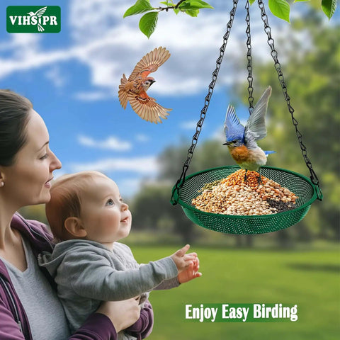 Hanging Bird Feeder For Outdoors 9 Inch Metal Mesh Tray Platform Perfect For Finches Chickadees Sparrows And Other Small Birds Green Backyard Feeder With Minimal Seed Waste And Easy Clean Design with birds and family in background