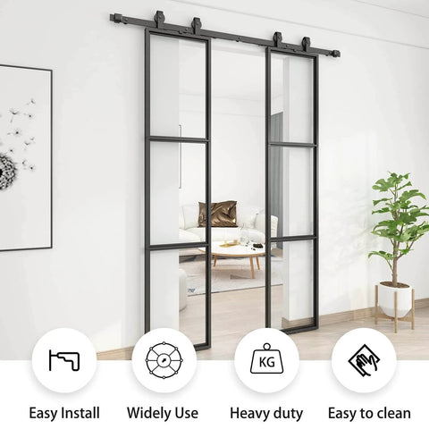 Double Barn Door Set 36 By 84 With 6Ft Hardware Kit And Soft Close Includes Two 18 By 84 Three Pane Clear Tempered Glass Panels Carbon Steel Frame Easy Assembly No Fuss Install Modern Rustic Look For Hallway Or Living Space installed in a living room.